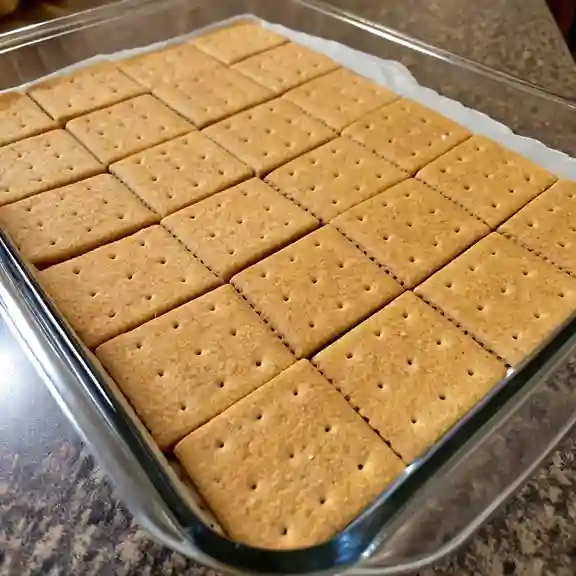 Laying graham crackers in baking dish