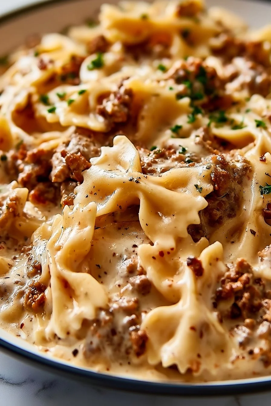 A delicious plate of Beef Cajun Pasta with colorful vegetables and spices.