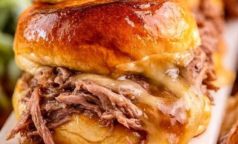 Delicious French Dip Sandwich Sliders served with au jus for dipping