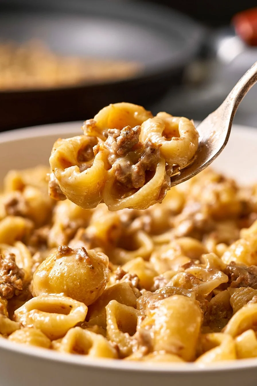 Creamy ground beef alfredo pasta dish with parmesan and herbs