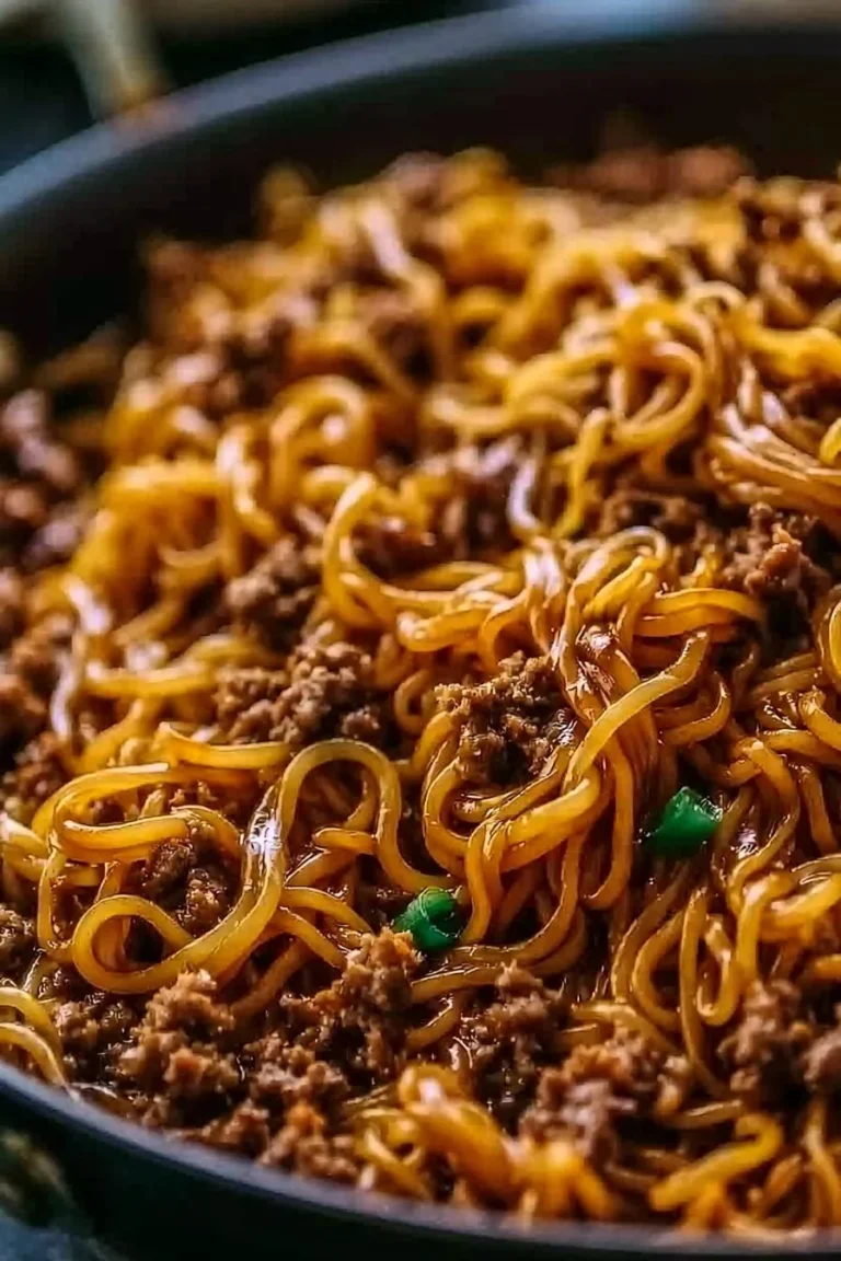 Plate of Mongolian ground beef noodles topped with green onions